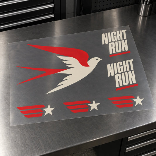 One translucent gang sheet with a sweeping bird, two NIGHT RUN designs and three wing-and-star emblems, with visible cutting gaps.