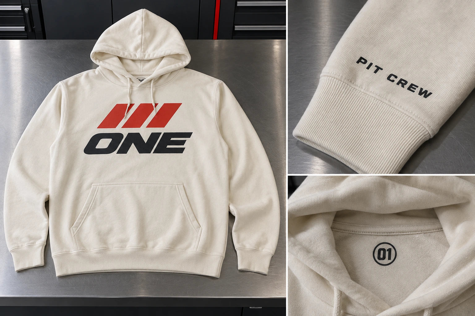 Ivory hoodie with ONE front artwork, PIT CREW sleeve lettering, and an 01 neck label.