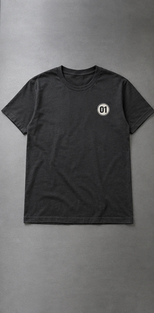 Charcoal T-shirts with a small 01 left-chest mark, a large ONE front print, and a PIT CREW back print. — Left-chest application